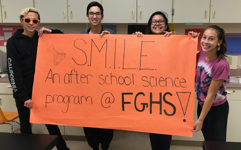 Forest Grove SMILE Club students create banner for parade