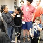 A team of students test their prosthetic leg design