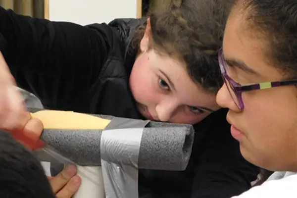 SMILE students work together at challenge on project