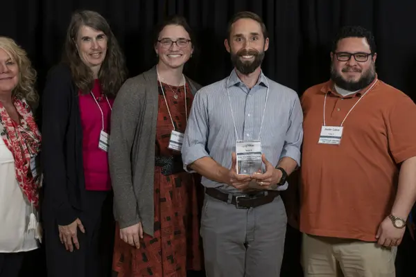 SMILE staff and partners with award